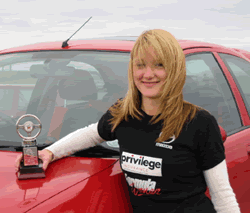 Suzanne shows her class award at Anglesey